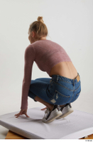  Kate Jones  1 blue jeans casual dressed kneeling pink long sleeve t shirt white sneakers whole body 0004.jpg